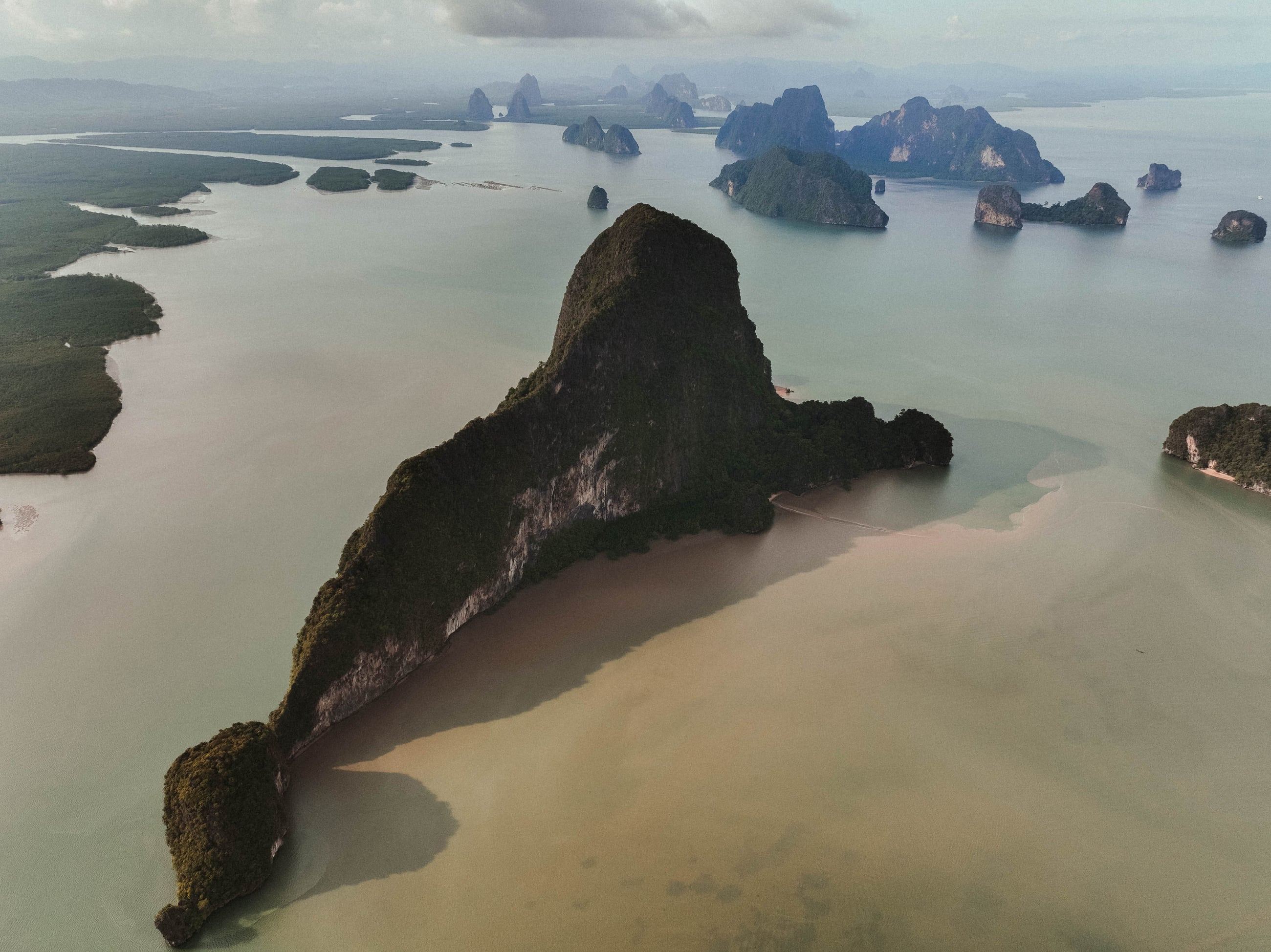 Limestone islands and mangrove shores in Phang Nga Bay, seen from above